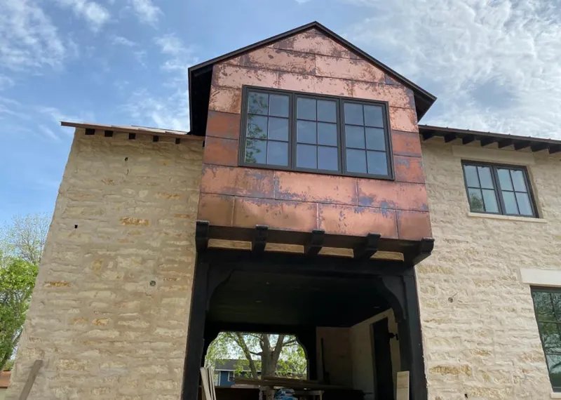 Copper metal panel facade on a stone building for Metal Roof Coating in Vancleave